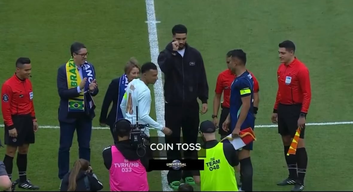 Jayson Tatum flips the coin ahead of France vs. Brazil