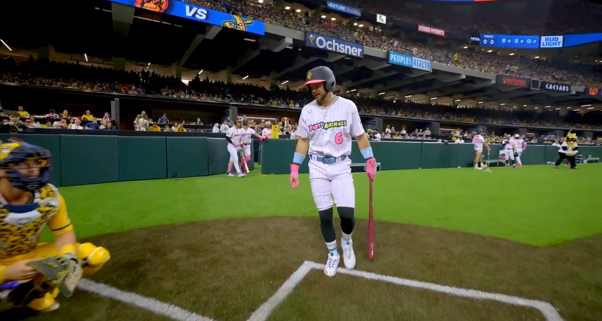 The Savannah Bananas catcher is offered a hand shake