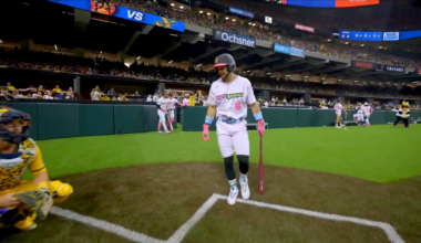 The Savannah Bananas catcher is offered a hand shake