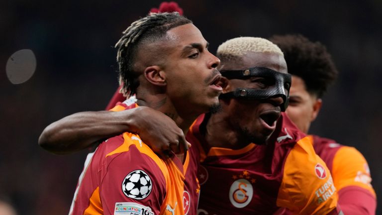 Galatasaray's Mario Lemina, left, celebrates after scoring the opening goal during a Champions League round of 16 first leg soccer match between Galatasaray and Liverpool, in Istanbul, Turkey, Tuesday, March 10, 2026. (AP Photo/Khalil Hamra)