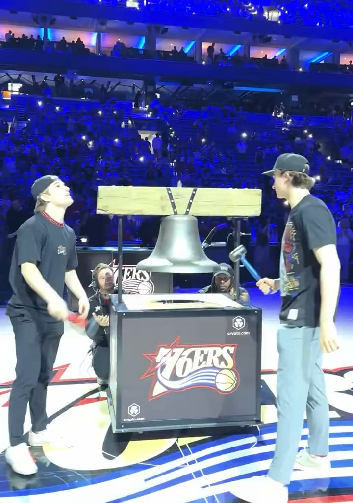 Denver Barkey and Porter Martone ring the bell for the Sixers Play In game.