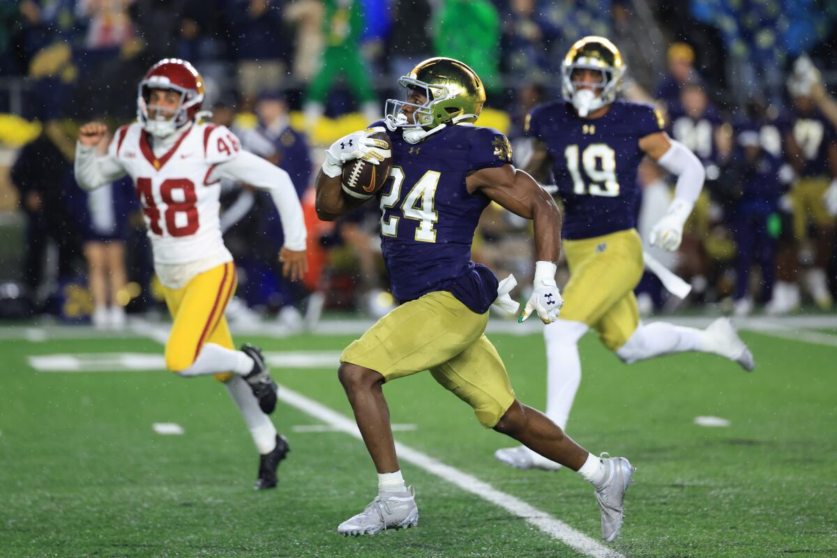 Notre Dame's Jadarian Price returns a kickoff for a touchdown against USC on Oct. 18.