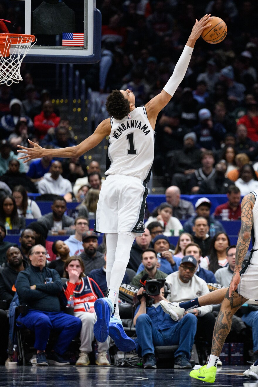 Feb 10, 2025; Washington, District of Columbia, USA; San Antonio Spurs center Victor Wembanyama (1) blocks a shot during the third quarter against the Washington Wizards at Capital One Arena.