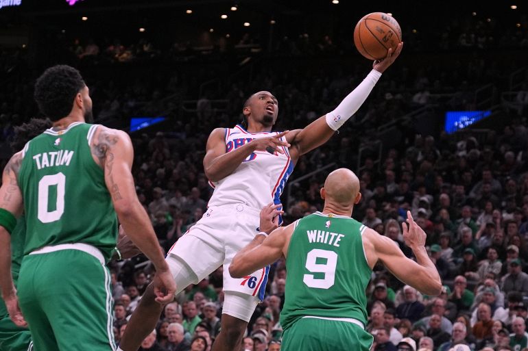 Philadelphia 76ers guard Tyrese Maxey (0) drives to the basket against the Boston Celtics during the second half of Game 2 of a first-round NBA playoffs basketball series, Tuesday, April 21, 2026, in Boston. (AP Photo/Charles Krupa)