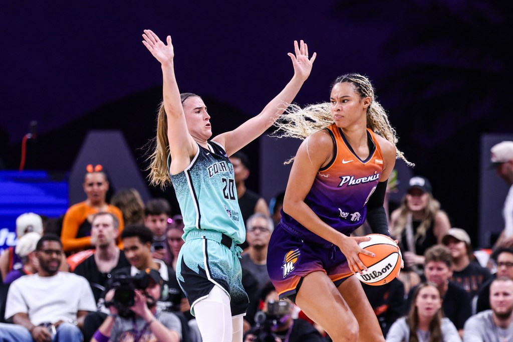 Satou Sabally #0 of the Phoenix Mercury looks to pass the ball around Sabrina Ionescu #20 of the New York Liberty during the second quarter during Game Three of the first round of the WNBA playoffs at PHX Arena on September 19, 2025 in Phoenix, Arizona. 