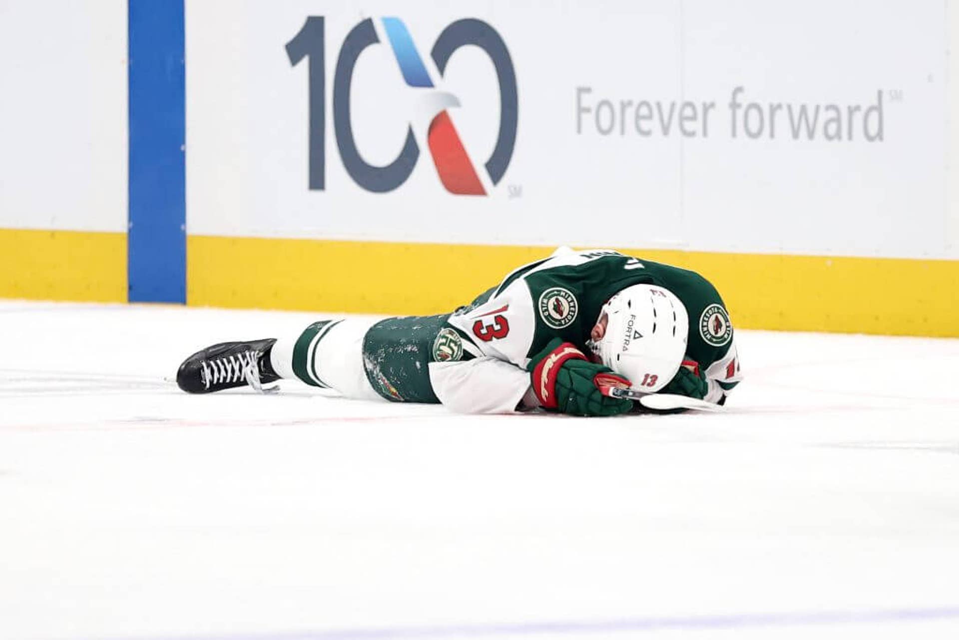 Yakov Trenin lays on the ice during the first period of Game 2 against the Stars on Monday.