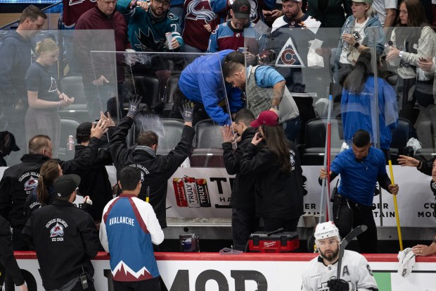 Arena crews replace a panel of glass broken by a fan during the second period of game two of the first round of the 2026 Stanley Cup Playoffs between the Colorado Avalanche and the Los Angeles Kings on Tuesday, April 21, 2026, at Ball Arena in Denver. (Photo by Timothy Hurst/The Denver Post)