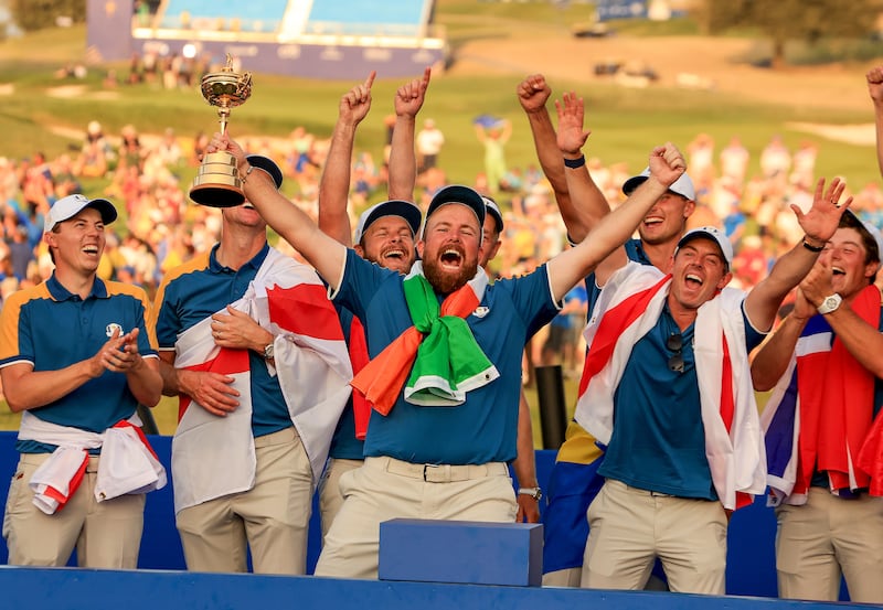 ROME, ITALY - OCTOBER 01: Shane Lowry of Ireland and The European Team roars with delight as he raises the Ryder Cup beside (L-R) Matthew Fitzpatrick, JKustin Rose, Tyrrell Hatton, Ludwig Aberg, Rory McIlroy and Viktor Hovland at the official presentation after the Sunday singles matches of the 2023 Ryder Cup at Marco Simone Golf Club on October 01, 2023 in Rome, Italy. (Photo by David Cannon/Getty Images)