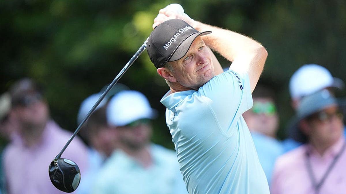 Justin Rose hits a tee shot