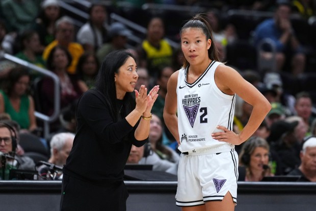 Golden State Valkyries head coach Natalie Nakase, left, talks with guard Kaitlyn Chen (2) on the sideline during the second half of a WNBA basketball game against the Seattle Storm, Wednesday, July 16, 2025, in Seattle. (AP Photo/Lindsey Wasson)