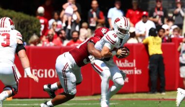 Alabama DL London Simmons (#90) sacks Wisconsin QB Danny O'Neil (#18) in 2025 game.