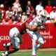 Alabama DL London Simmons (#90) sacks Wisconsin QB Danny O'Neil (#18) in 2025 game.
