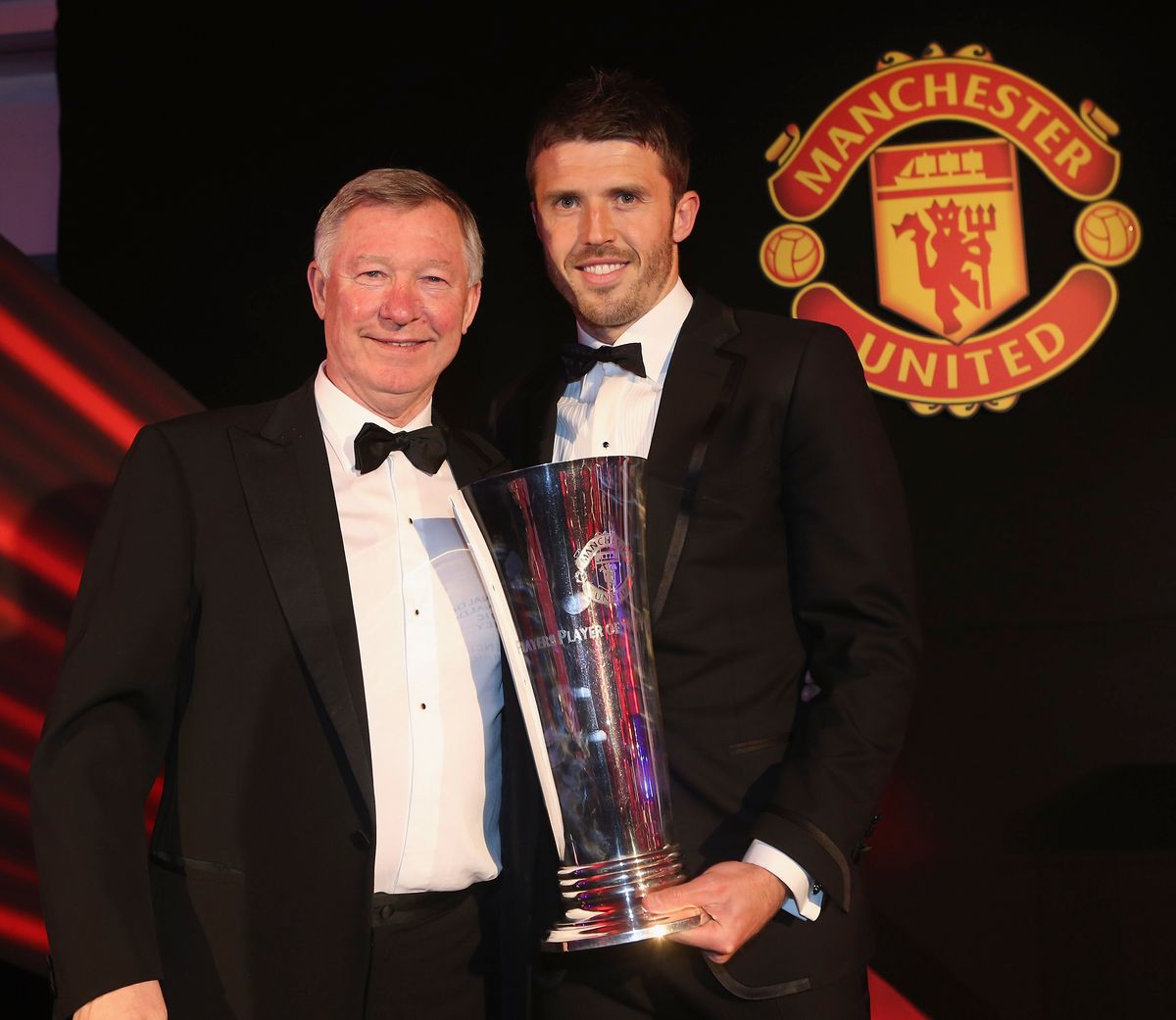 Michael Carrick of Manchester United is presented with the Players' Player of the Year by Sir Alex Ferguson at the club's annual Player of the Year awards ceremony at Old Trafford