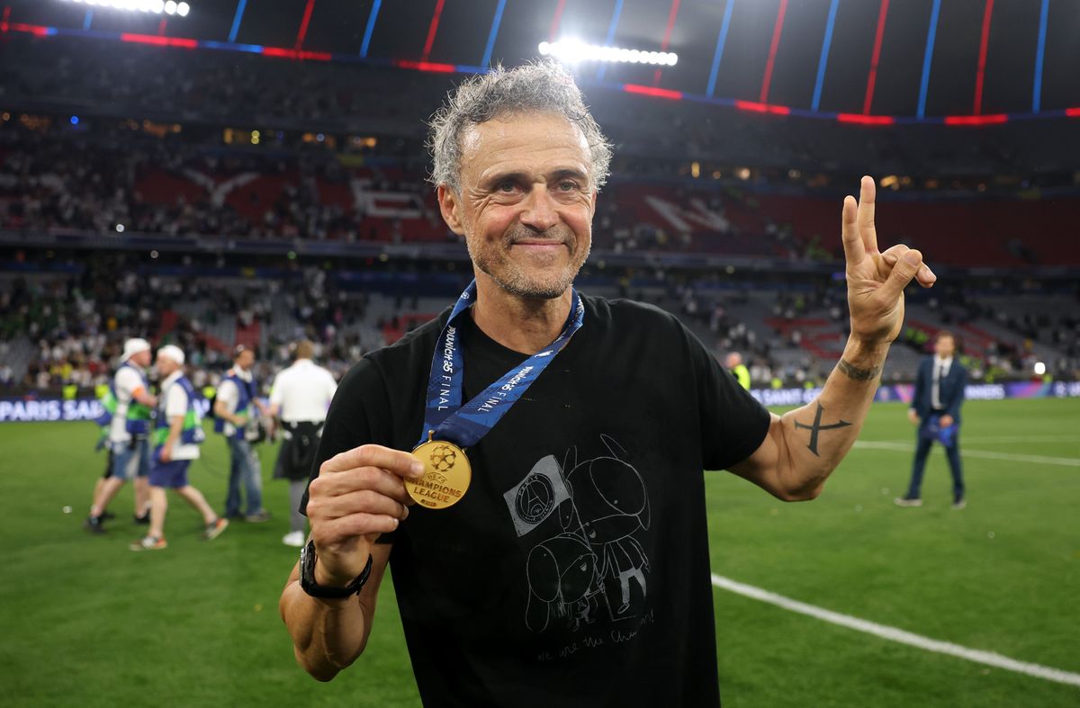  Luis Enrique, Head Coach of Paris Saint-Germain, poses for a photo with his winners medal.
