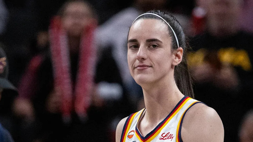 Indiana Fever guard Caitlin Clark (22) looks on before a game.Trevor Ruszkowski-Imagn Images