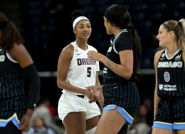 The Dream's Angel Reese and the Sky's Kamilla Cardoso greet one another just before tipoff of a preseason game at Wintrust Arena on April 29, 2026. (Chris Sweda/Chicago Tribune)