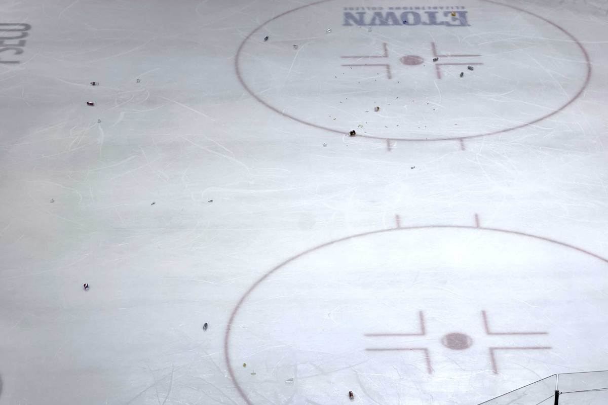 Hershey Bears fans throw debris on the ice after jumbotron replay appears to show Rutger McGroarty’s overtime game-winner didn’t go in