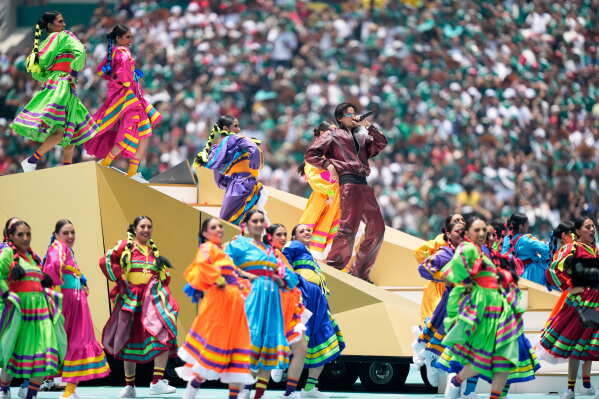 Colombian singer J Balvin performs before the start of the World Cup Group A soccer match between Mexico and South Africa in Mexico City, Thursday, June 11, 2026. (AP Photo/Natacha Pisarenko)