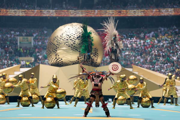 Performers on the pitch during the opening ceremony before the start of the World Cup Group A soccer match between Mexico and South Africa in Mexico City, Thursday, June 11, 2026. (AP Photo/Natacha Pisarenko)