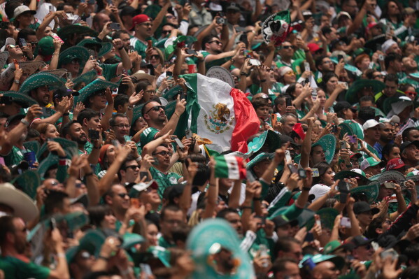 Mexican fans cheer before the World Cup Group A soccer match between Mexico and South Africa in Mexico City, Thursday, June 11, 2026. ((AP Photo/Silvia Izquierdo)