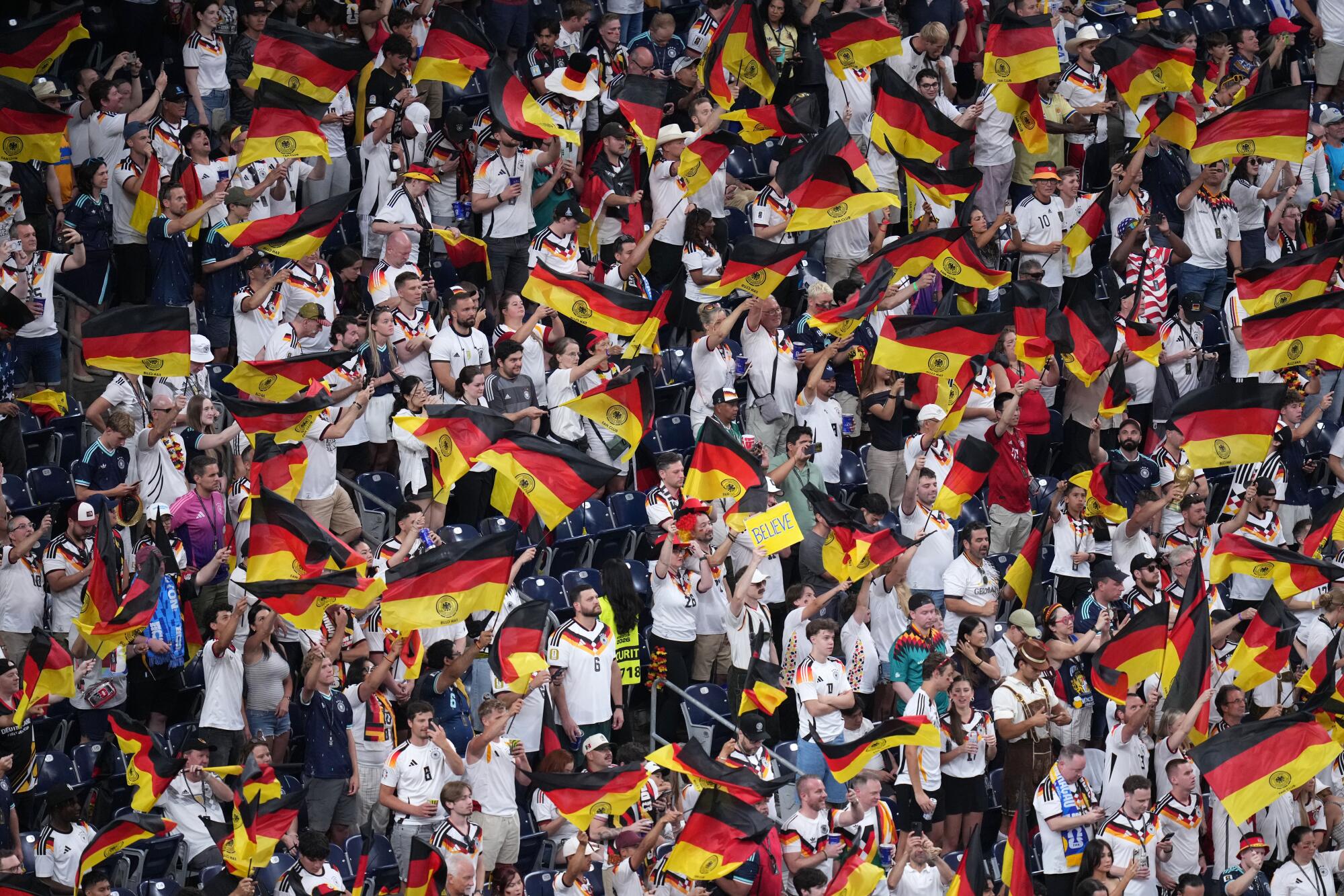 Germany fans cheer during the World Cup Group E soccer match between Germany and Curacao in Houston on Sunday.