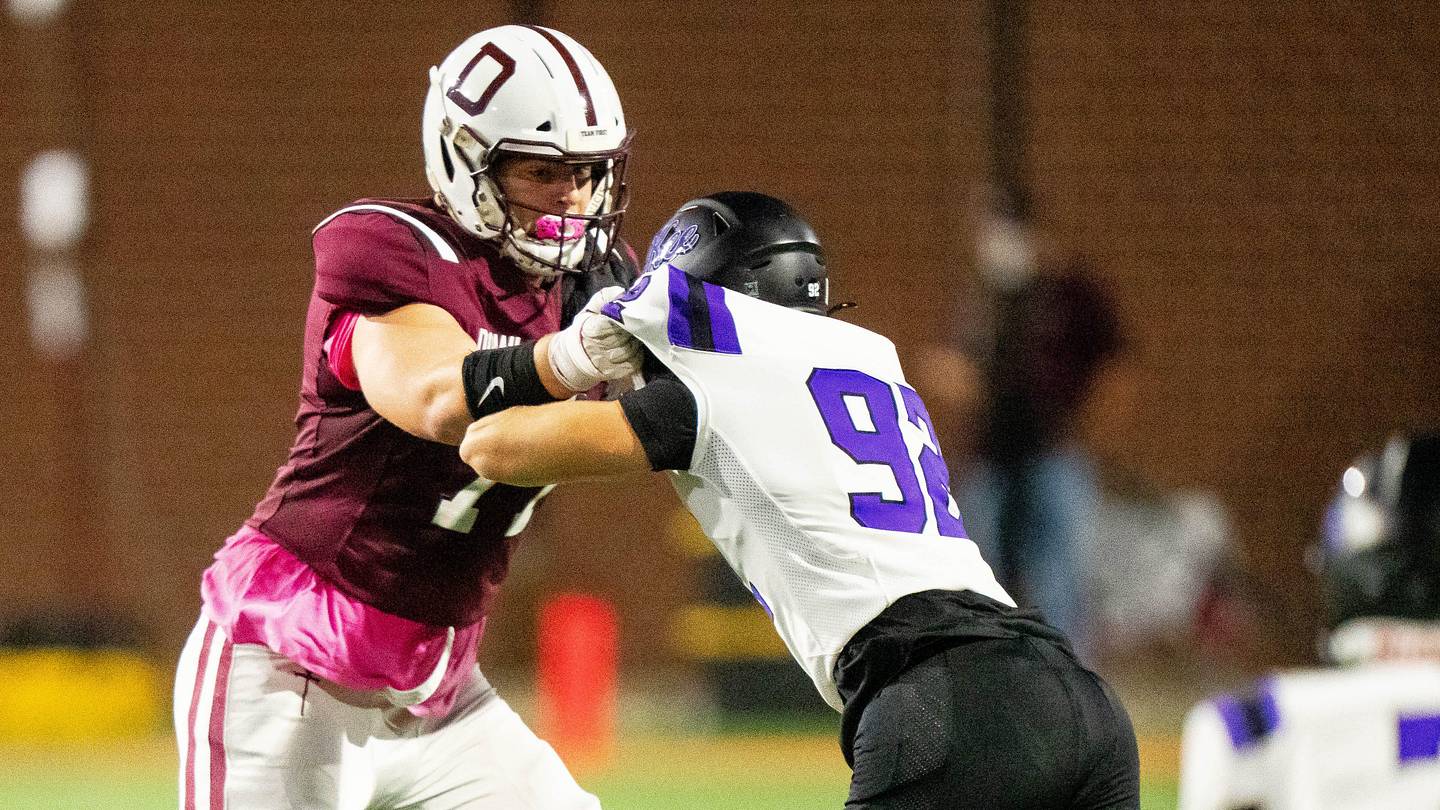 Dowling Catholic’s Carter Barrett (77) blocks during a game against Waukee on Oct. 10, 2025, at Valley Stadium in West Des Moines.