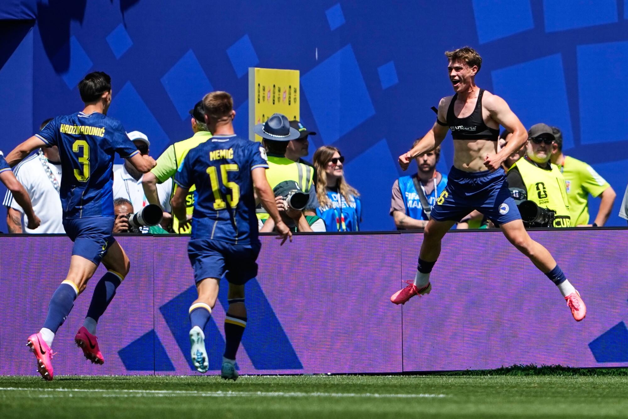 Bosnia's Ermin Mahmic took off his jersey as he celebrates scoring against Qatar during a World Cup match in Seattle on Wednesday.