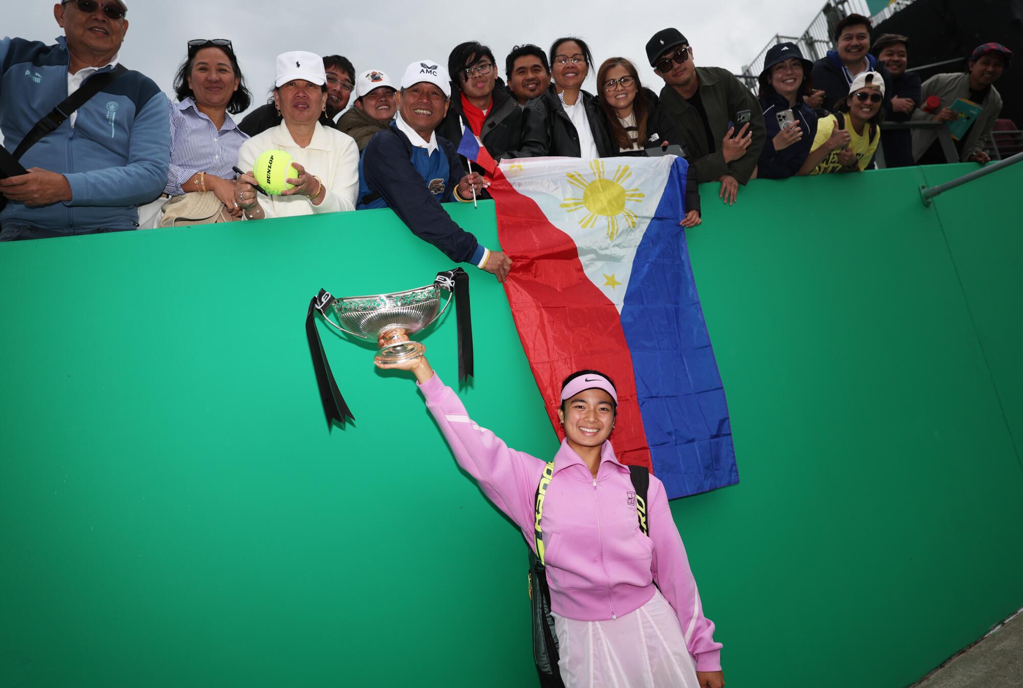 Alexandra Eala of Philippines celebrates with fans after beating Nikola Bartunkova during the Birmingham Open.