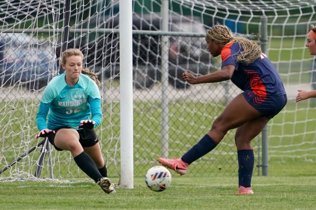 Oswego's Jordyn Washington (18) shoots the ball against Waubonsie Valley's Charlee Vanderwatt (32) during a Class 3A Oswego Regional semifinal game on Thursday, May 22, 2025. (Sean King / The Beacon-News)