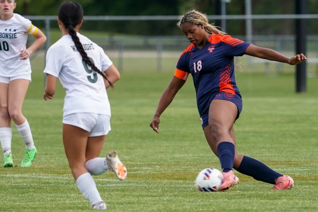 Oswego's Jordyn Washington (18) works the ball against Waubonsie Valley during a Class 3A Oswego Regional semifinal game on Thursday, May 22, 2025. (Sean King / The Beacon-News)