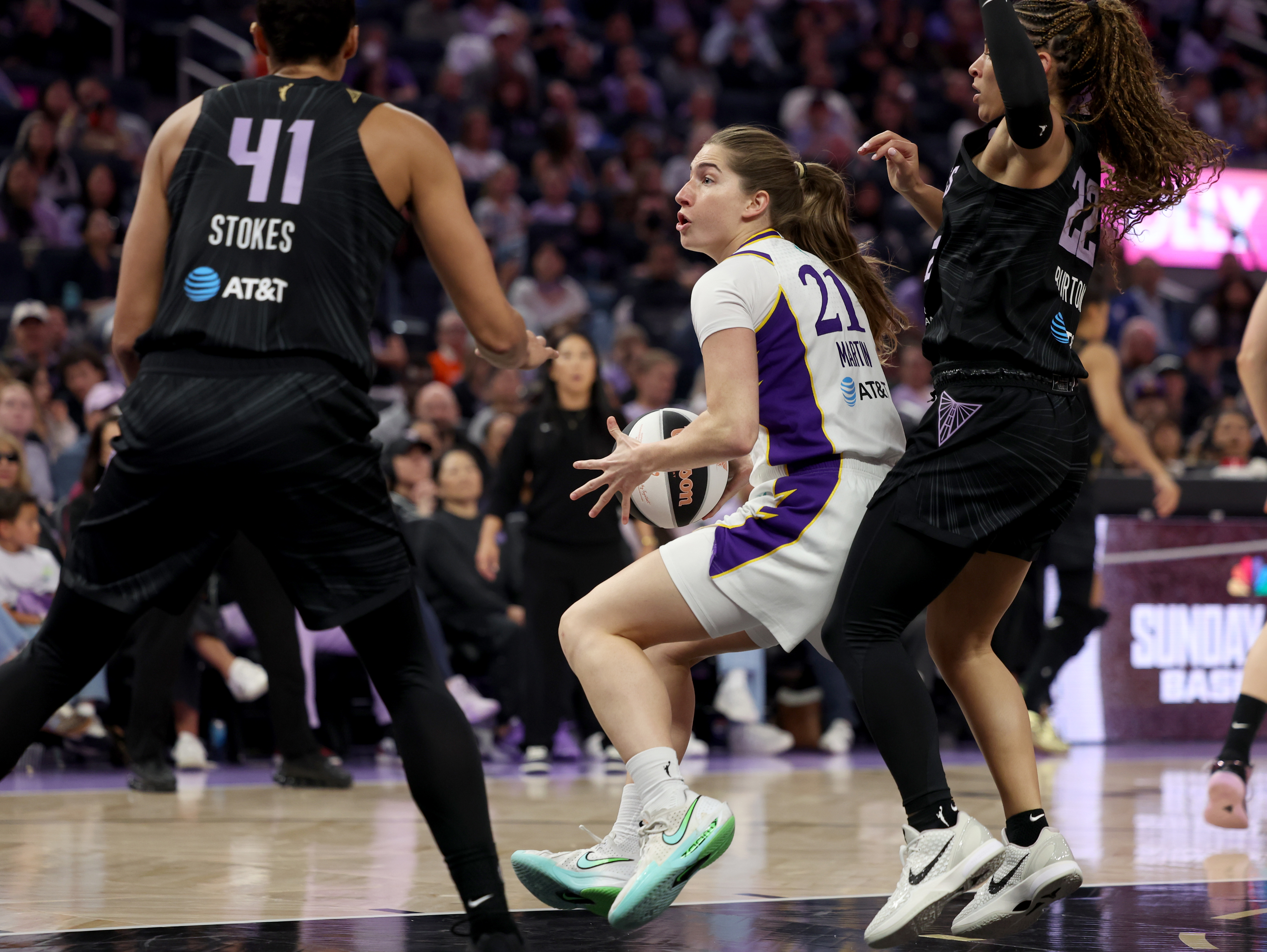 Los Angeles Sparks' Kate Martin #21 is guarded by Golden...