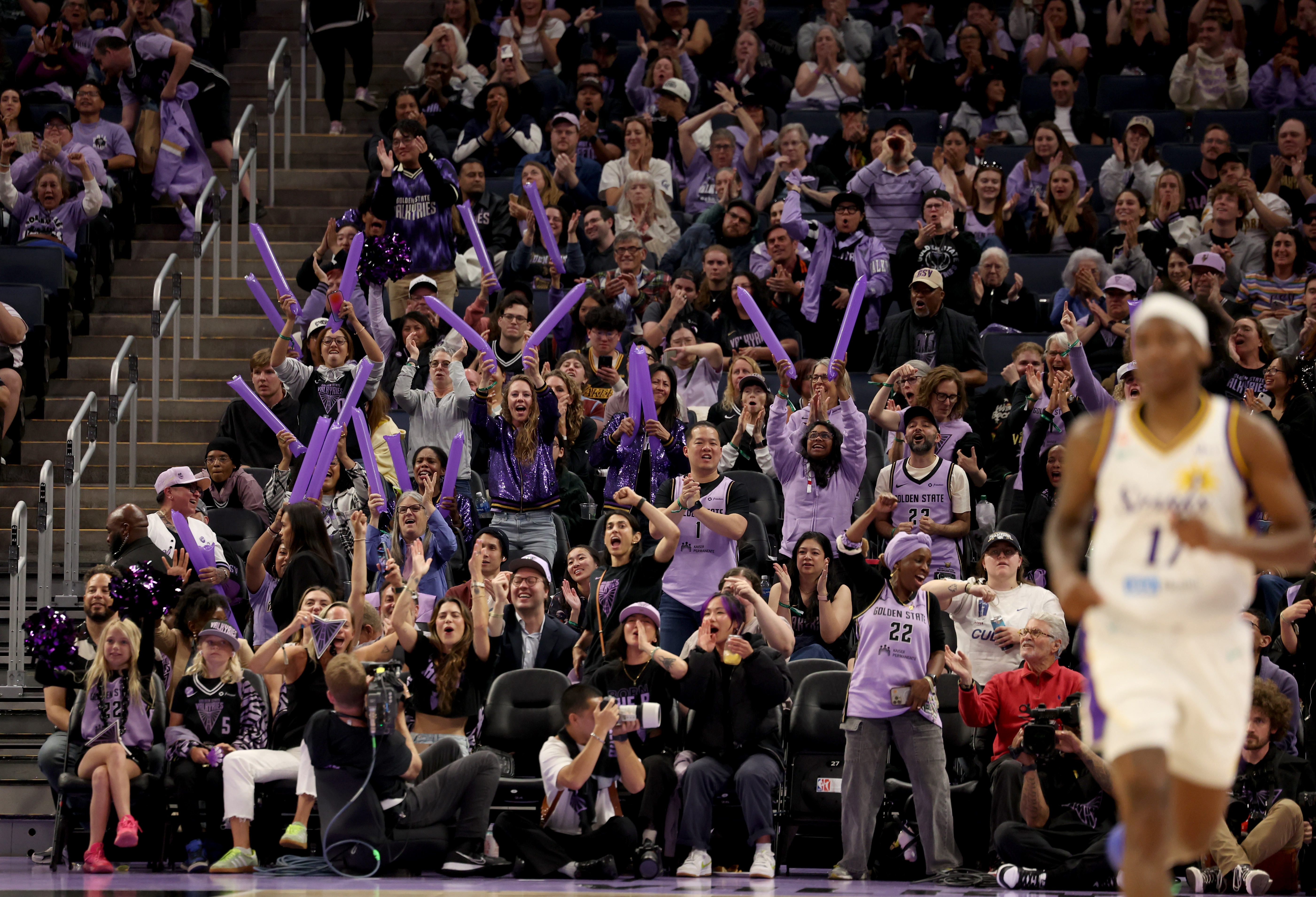 Golden State Valkyries fans cheer after a basket in the...