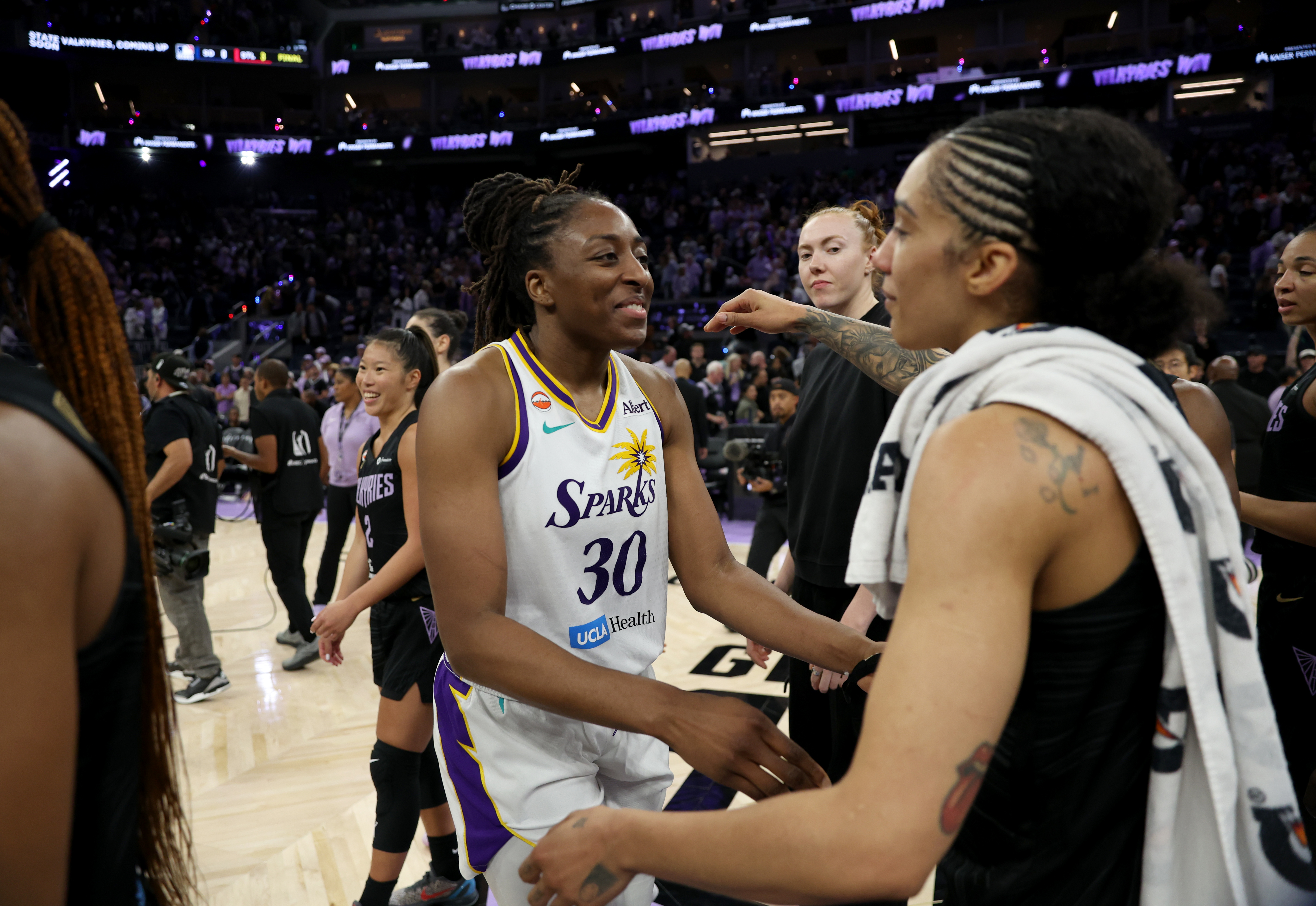 Los Angeles Sparks' Nneka Ogwumike #30 congratulates Golden State Valkyries'...