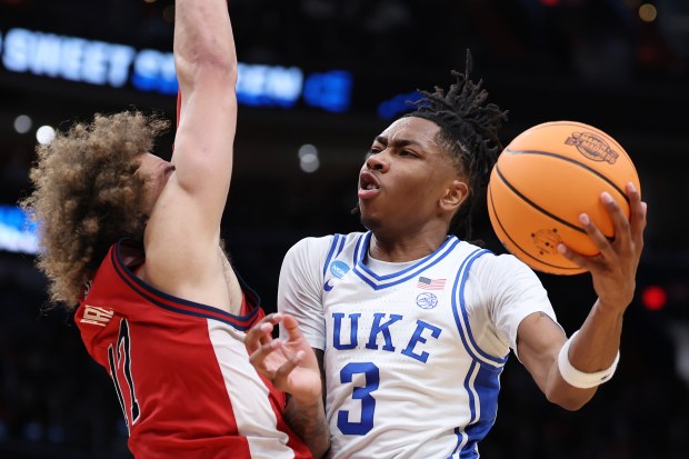 Isaiah Evans #3 of the Duke Blue Devils shoots the ball against Rubén Prey #17 of the St. John's Red Storm during the first half in the Sweet Sixteen of the 2026 NCAA Men's Basketball Tournament at Capital One Arena on March 27, 2026 in Washington, DC. (Photo by Emilee Chinn/Getty Images)