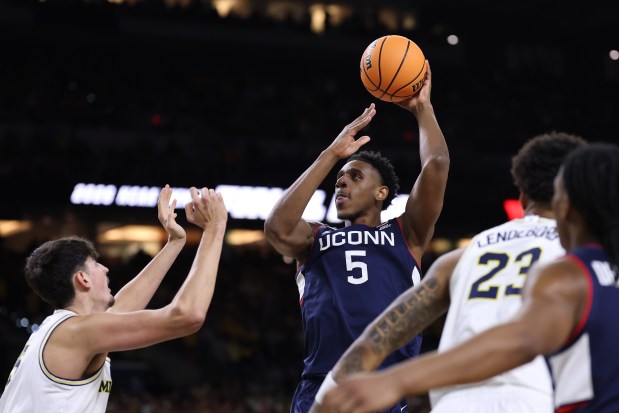 Tarris Reed Jr. #5 of the UConn Huskies shoots the ball over Aday Mara #15 of the Michigan Wolverines during the first half of a game in the National Championship of the 2026 NCAA Men's Basketball Tournament at Lucas Oil Stadium on April 06, 2026 in Indianapolis, Indiana. (Photo by Patrick Smith/Getty Images)