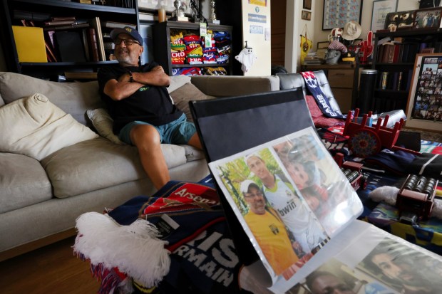 Cherif Zein, a longtime youth and high school soccer coach, and former UCLA player, has a book filled with photos of him with legendary players such as Pelé, Diego Maradona, Lionel Messi, Cristiano Ronaldo and more, shown here inside his home in Arcadia on Wednesday, June 17, 2026. (Photo by Trevor Stamp, Contributing Photographer)