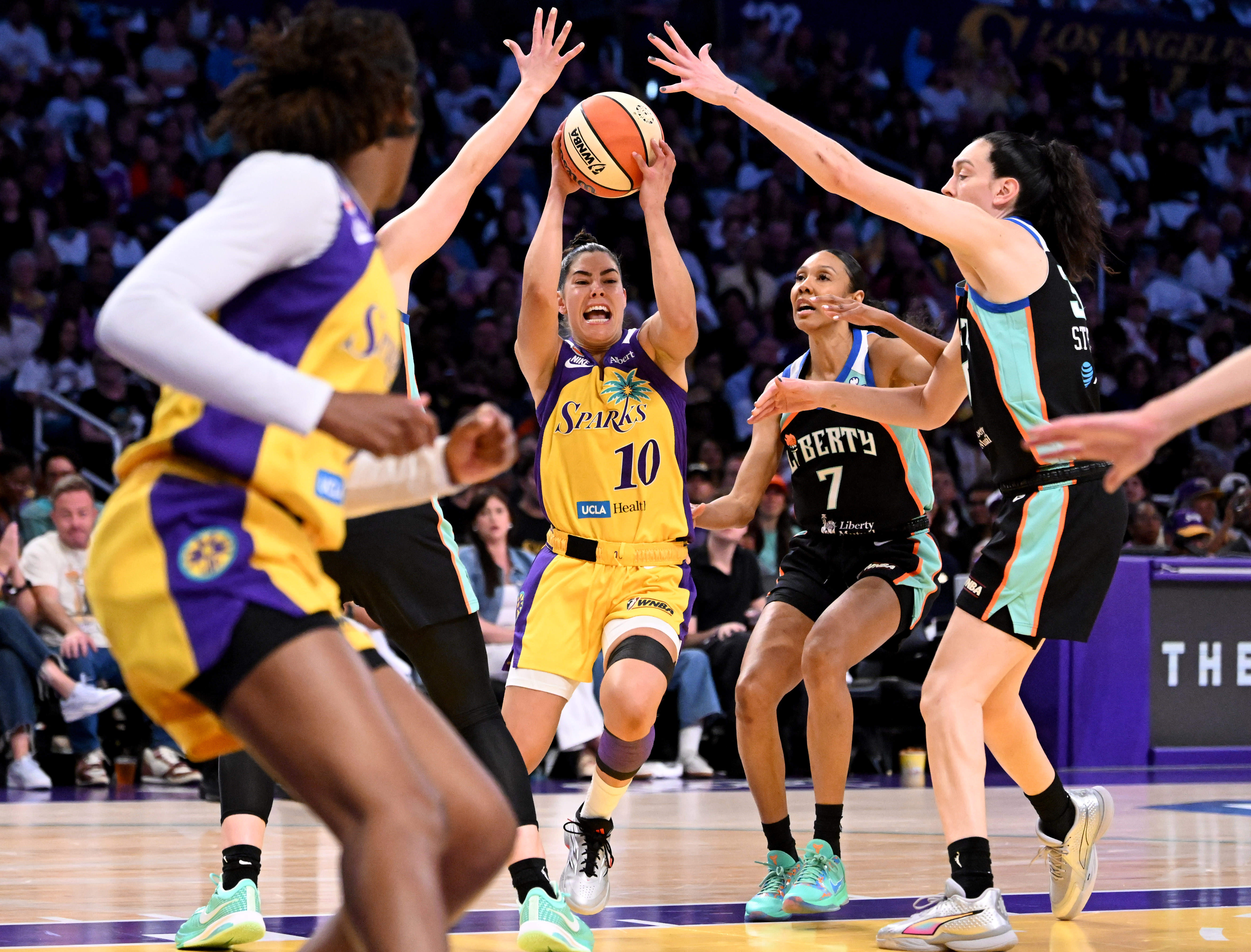 Sparks guard Kelsey Plum (10) rebounds the ball in the...
