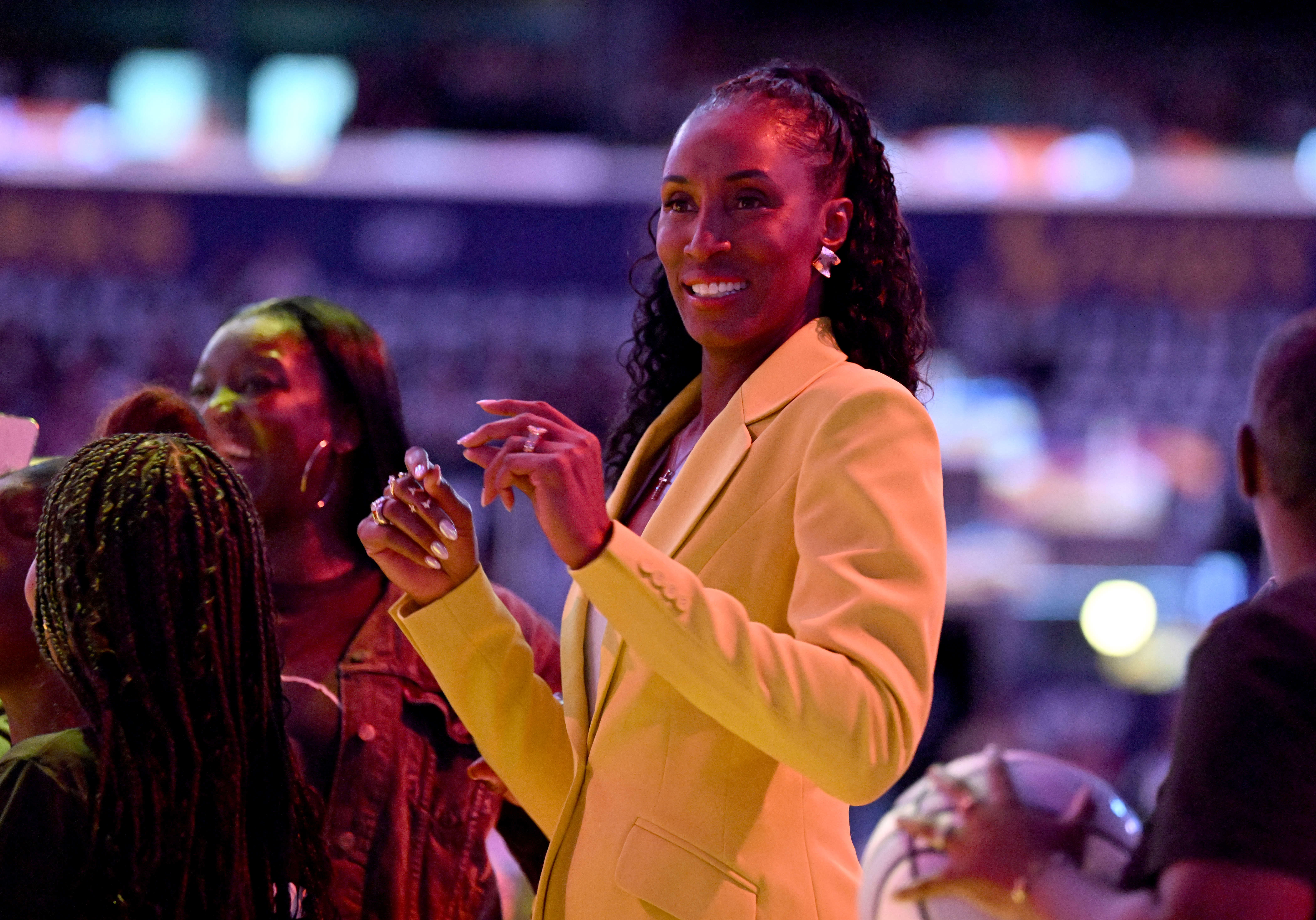 WNBA legend Lisa Leslie smiles prior to the start of...