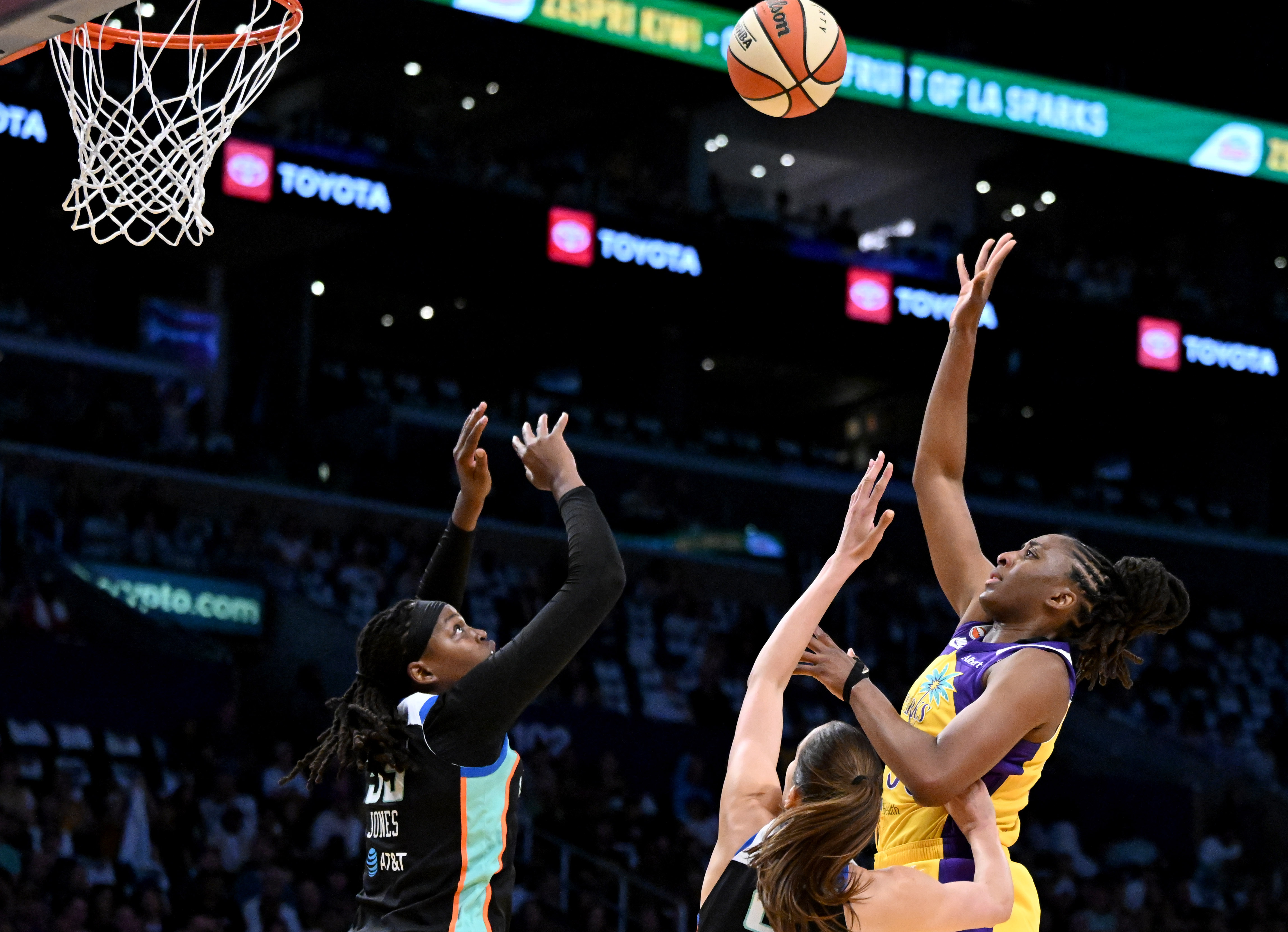Sparks forward Nneka Ogwumikein (30) takes a shot over New...
