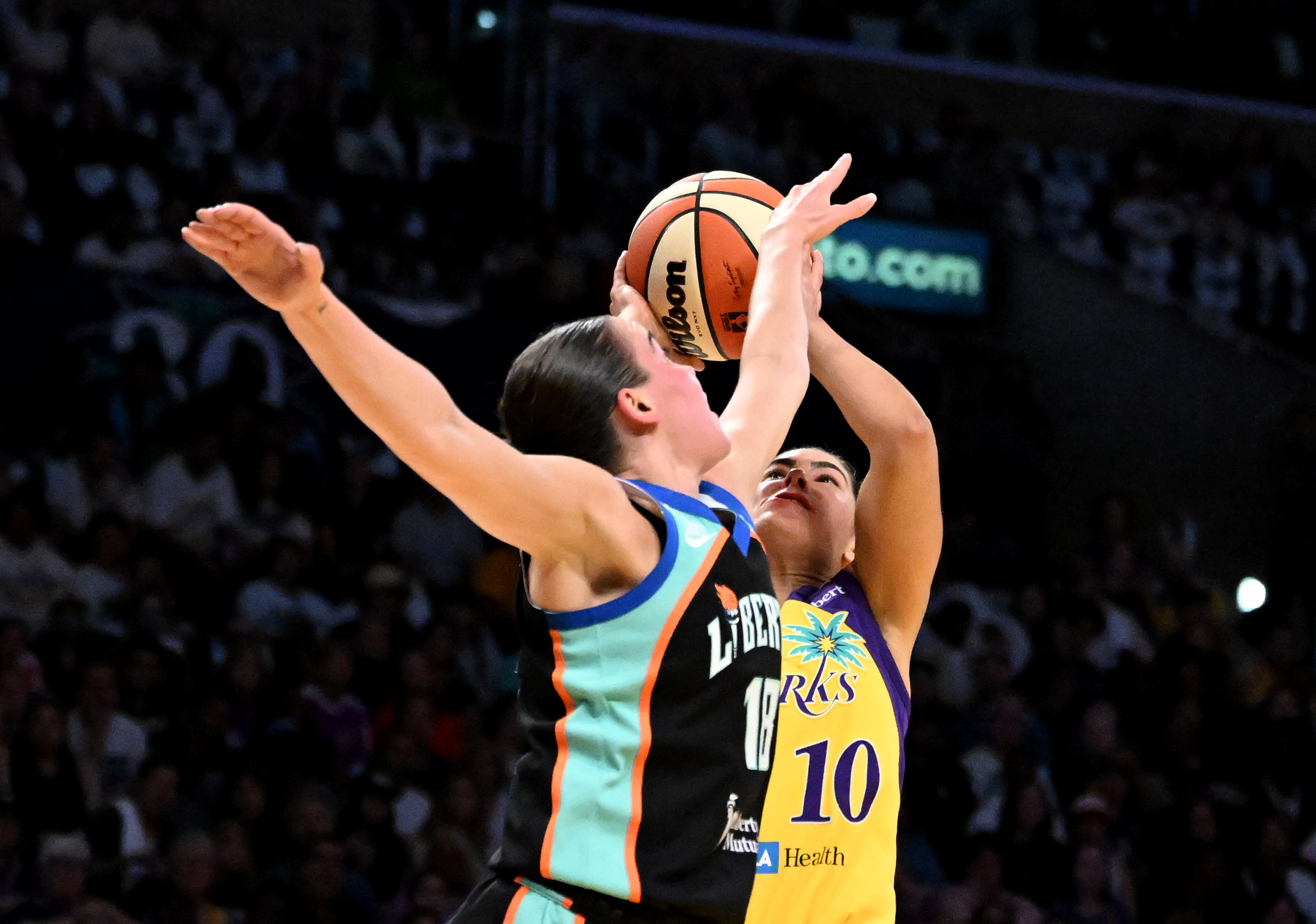 Sparks guard Kelsey Plum (10) takes a shot over New...
