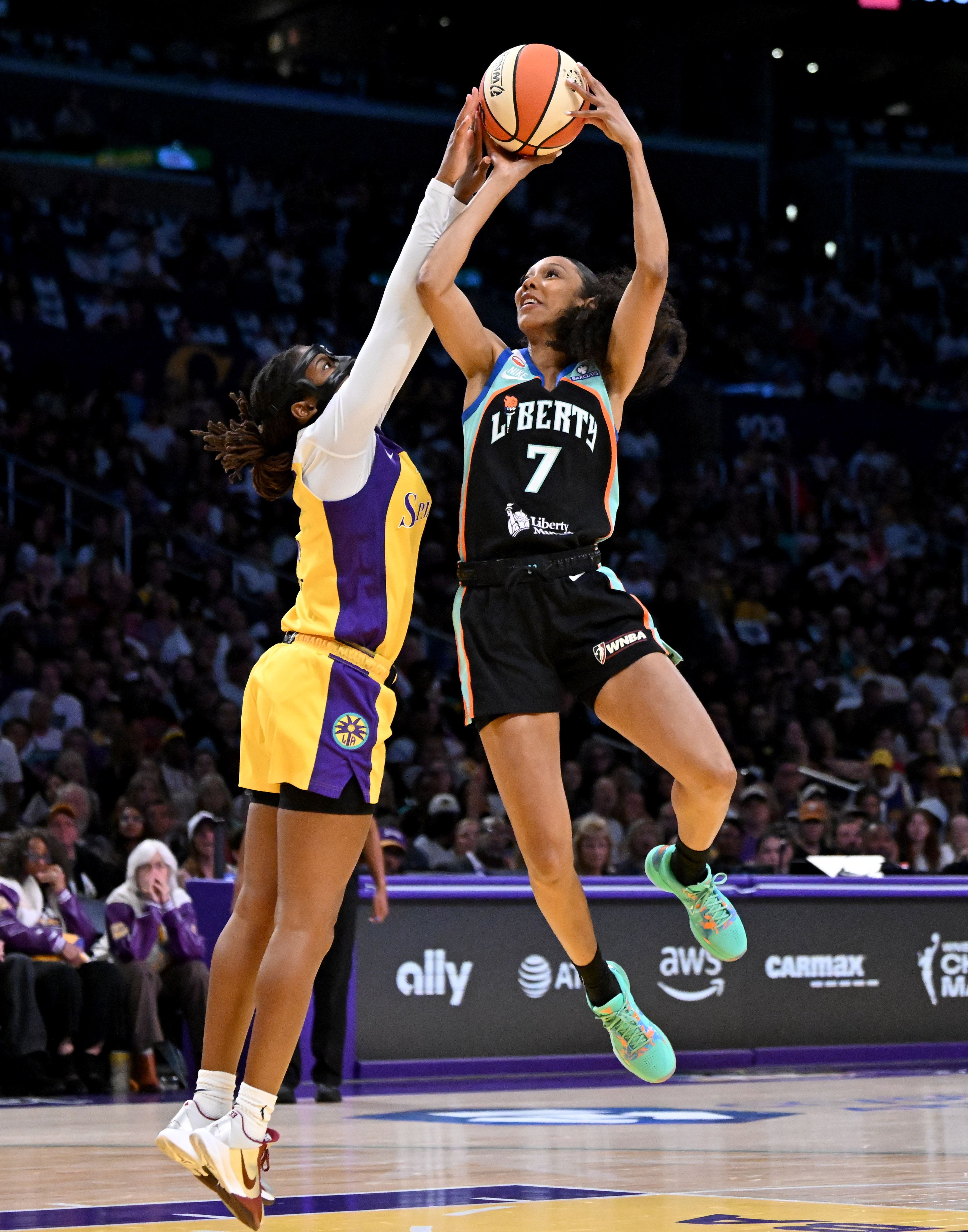 Sparks guard Ariel Atkins (7) blocks a shot by New...