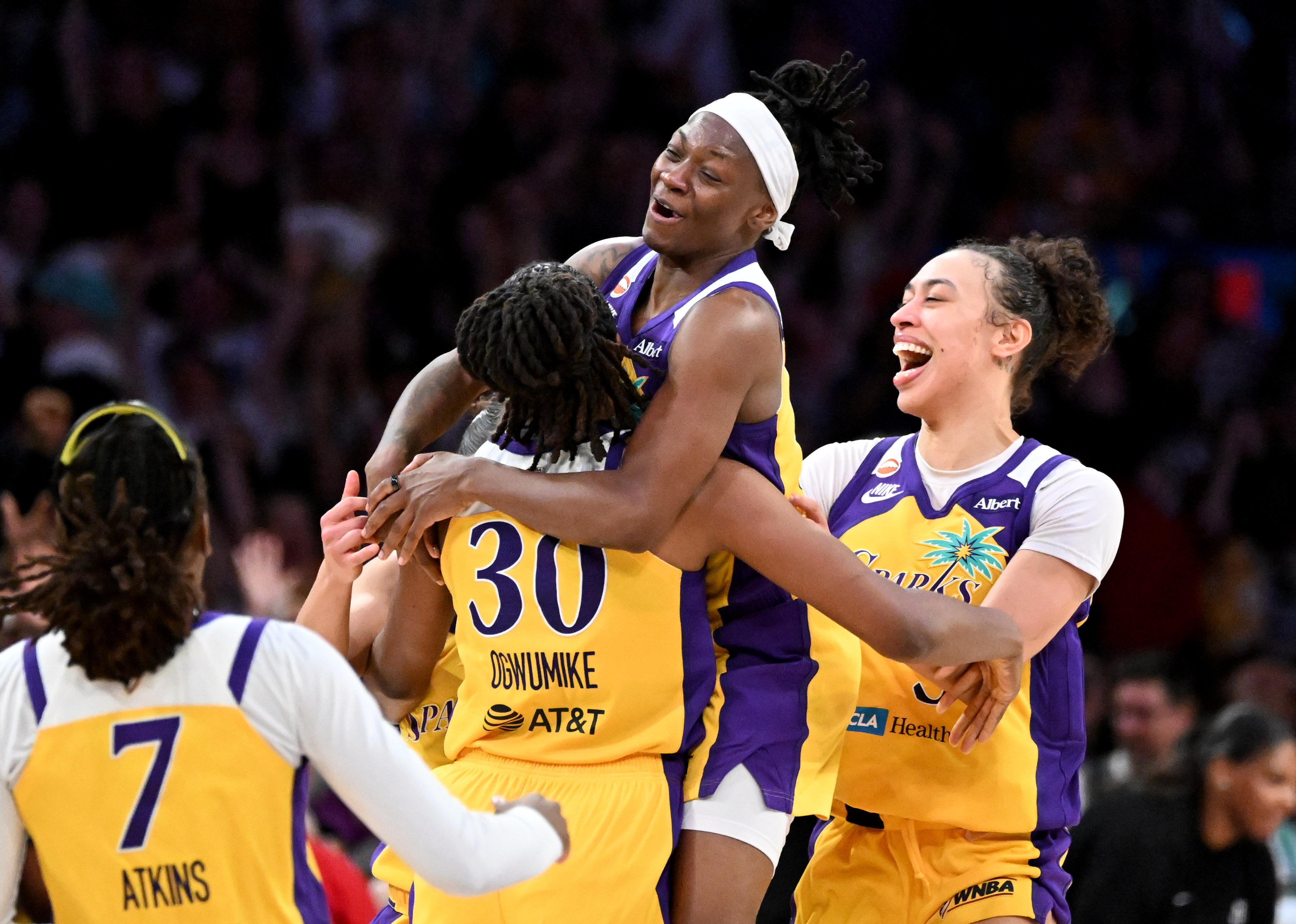 Sparks Nneka Ogwumike (30) is hugged by her teammates after...