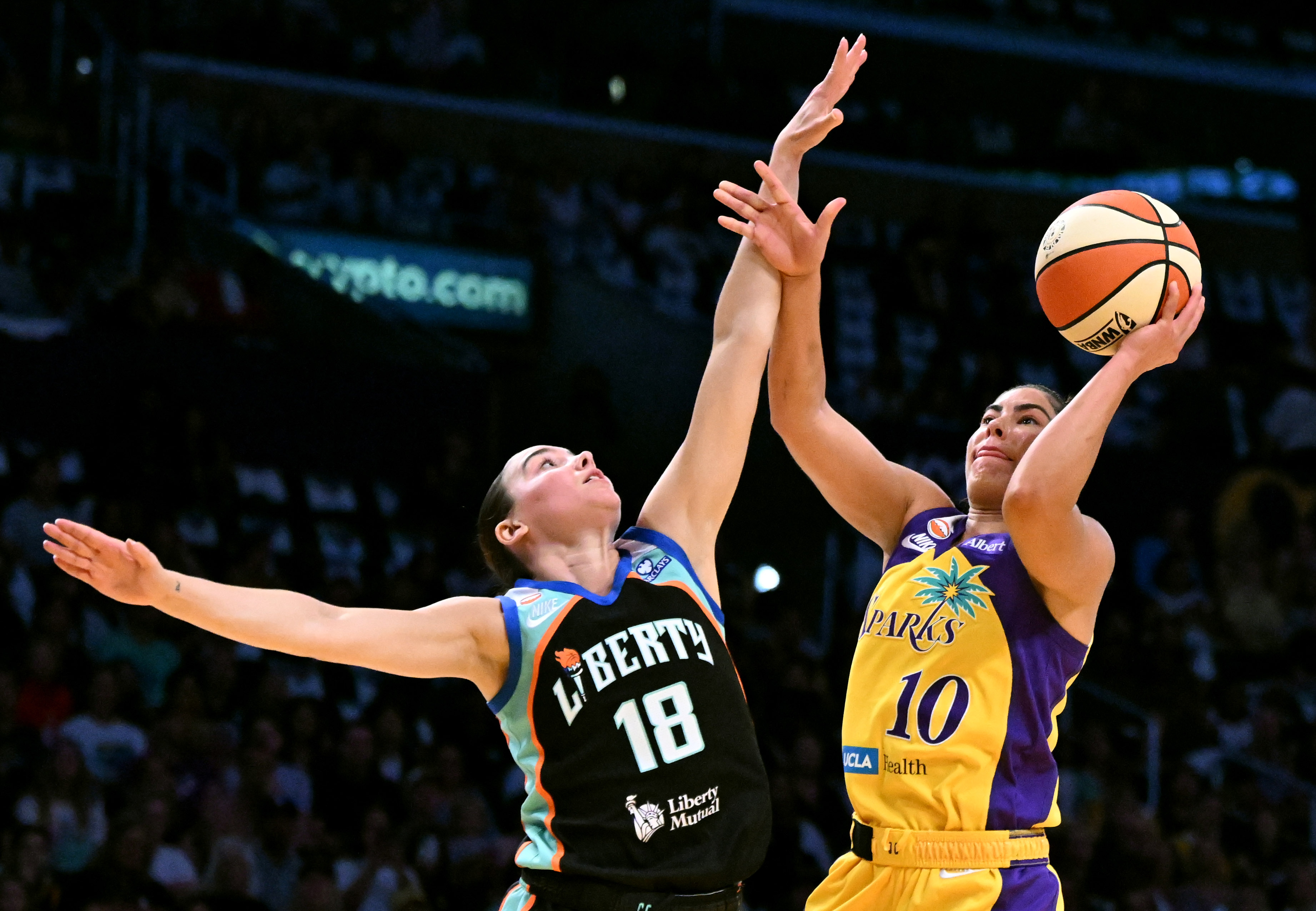 Sparks guard Kelsey Plum (10) takes a shot past New...