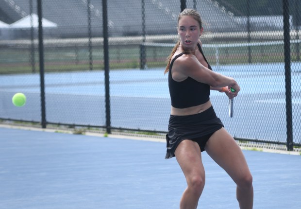  Sarah Siolkowski of East Catholic returns a shot against New Canaan's Leah Zhang Wednesday at the State Open girls tennis championship at Hall High School in West Hartford. Zheng won, 6-3, 7-5. (Photo by Lori Riley)
