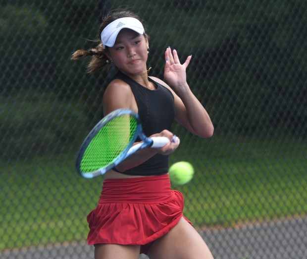 New Canaan's Leah Zheng returns a shot during the State Open girls tennis championship Wednesday at Hall High School in West Hartford. Zheng defended her title with a 6-3, 7-5 victory. (Photo by Lori Riley)