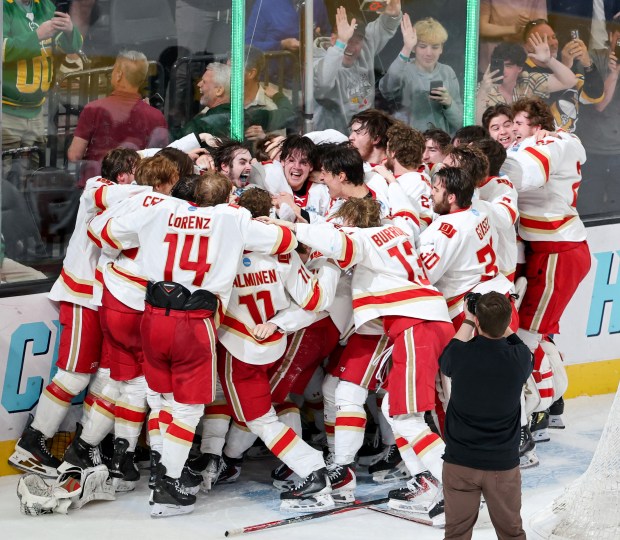 Members of the Denver Pioneers celebrate their 2-1 victory over the Wisconsin Badgers to win the NCAA Division I men's ice hockey championship game at T-Mobile Arena on April 11, 2026 in Las Vegas, Nevada. (Photo by Ethan Miller/Getty Images)