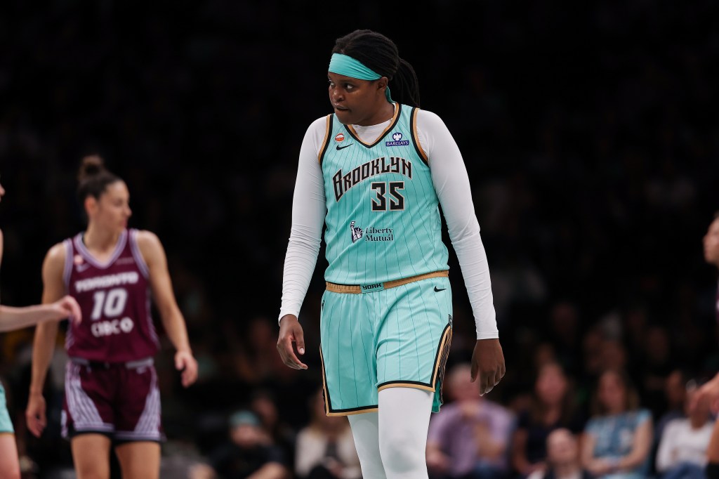 WNBA player Jonquel Jones looks on during the game.