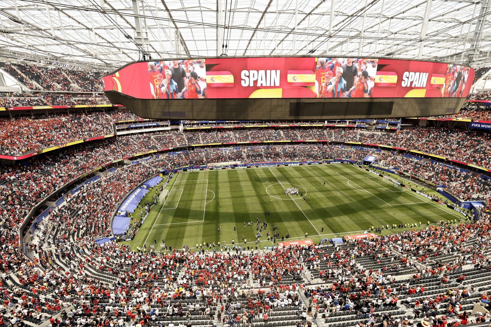 Spain players and fans celebrate after a 2-1 win over Belgium in the World Cup quarterfinals on Friday afternoon.