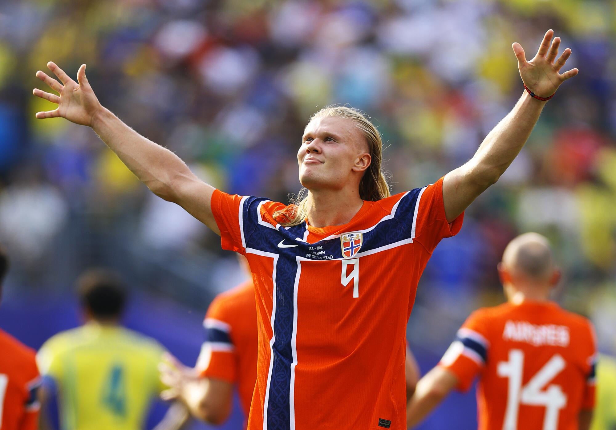 Erling Haaland of Norway gestures toward fans after scoring his team's second goal against Brazil during the World Cup.