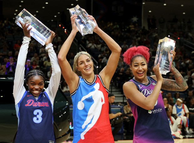 Jazelle "GG" Banks, from left, Elena Delle Donne and Shakira Austin celebrate after winning the WNBA All-Star Shooting Stars competition Friday, July 24, 2026, at Wintrust Arena. (Chris Sweda/Chicago Tribune)